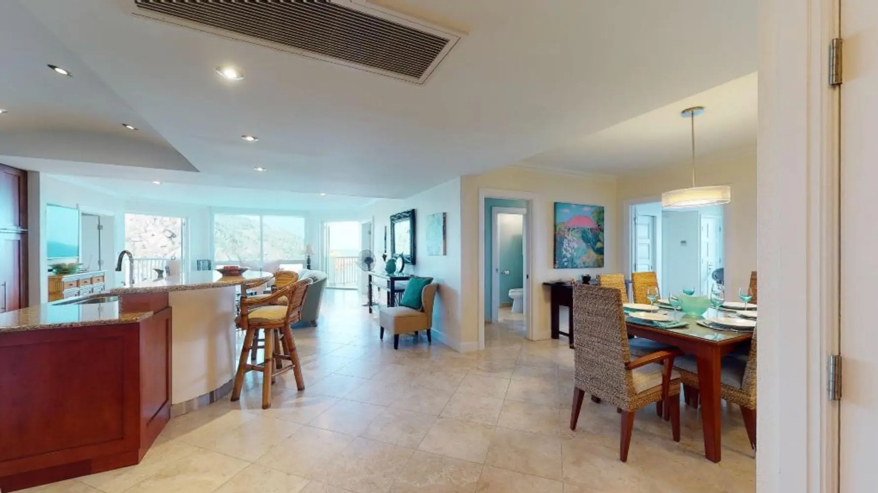 Contemporary kitchen and living space in Oyster Pond condo