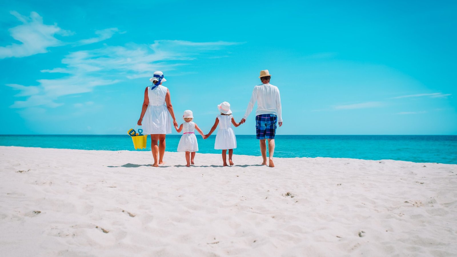 Family walking on the beach in St. Maarten