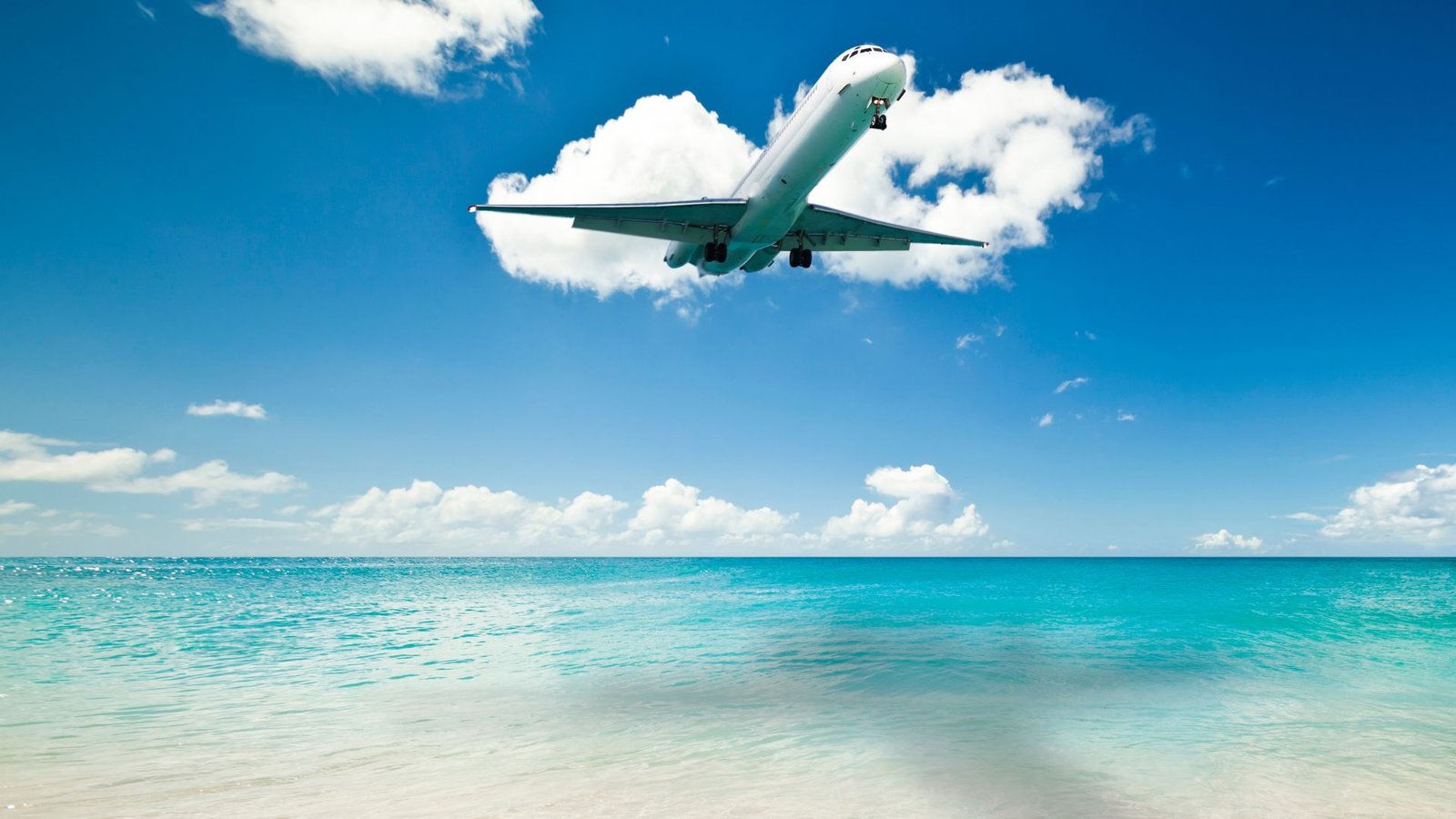 Airplane landing over Maho beach in St. Maarten SXM