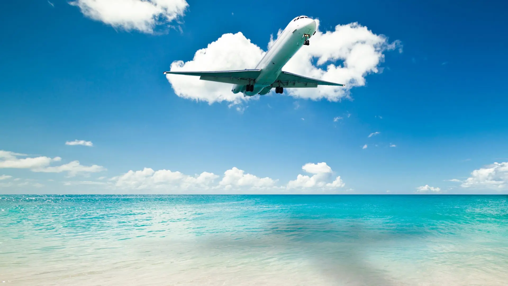 Airplane landing over Maho beach in St. Maarten SXM